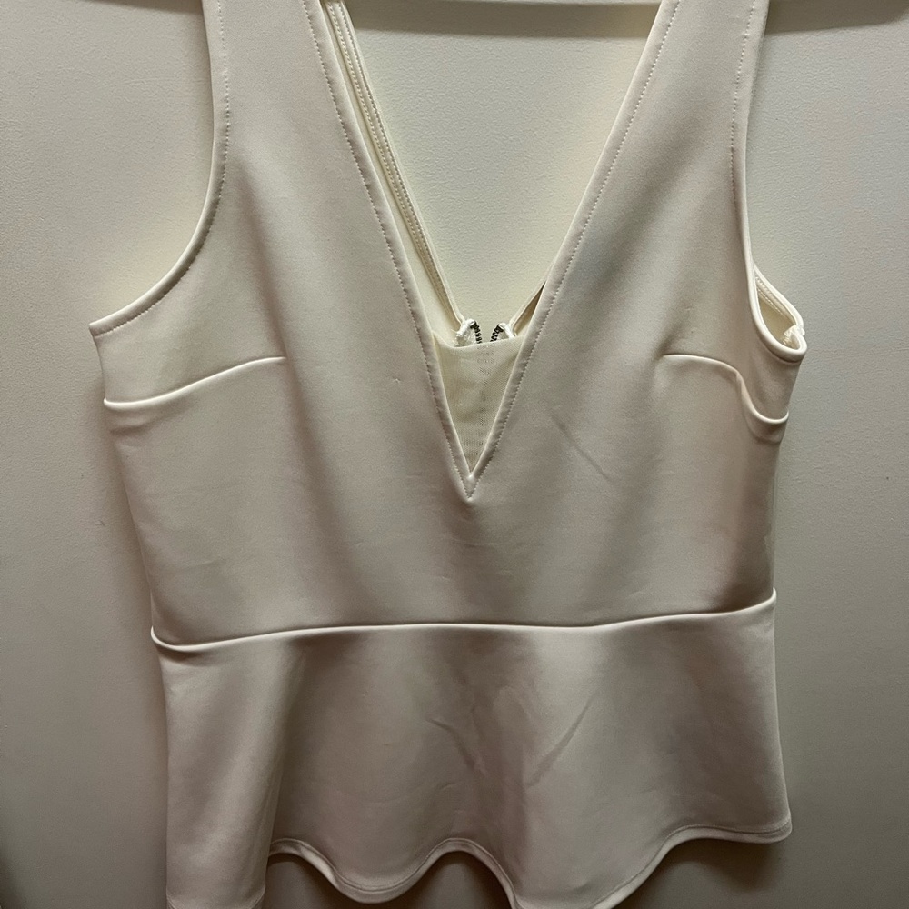 White peplum top